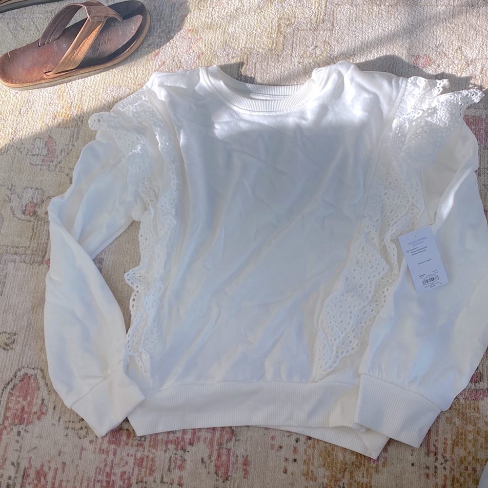 Cream ruffled sweatshirt
